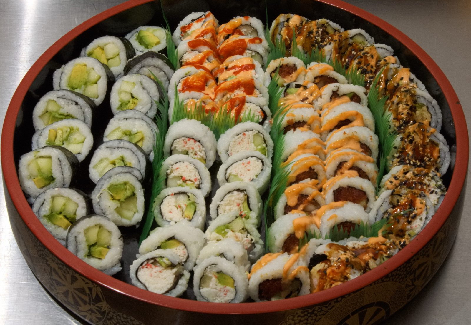 Vegetable, California and spicy rolls in rows